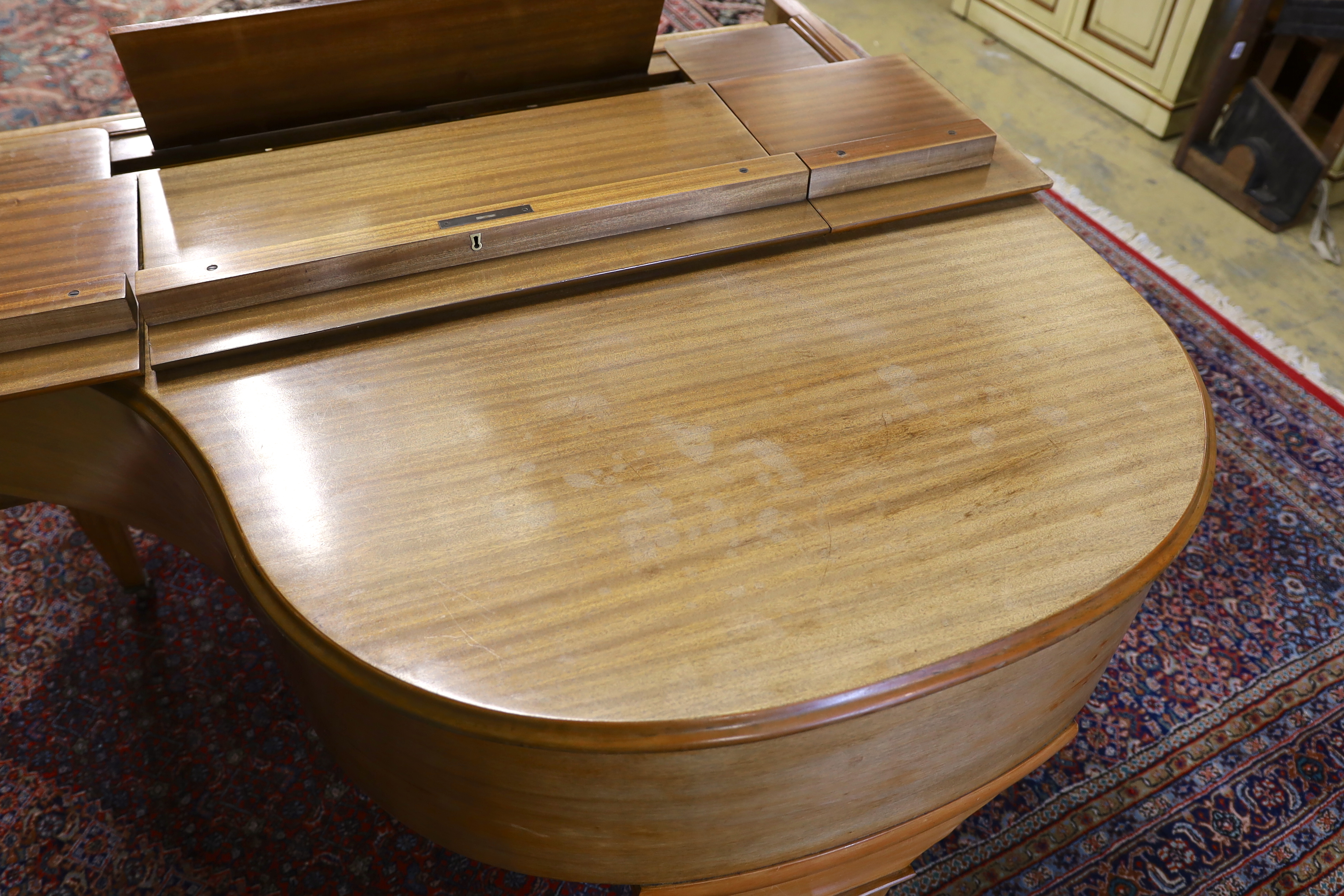 A mid 20th Cecilian & Co mahogany baby grand piano retailed by Harrods Ltd